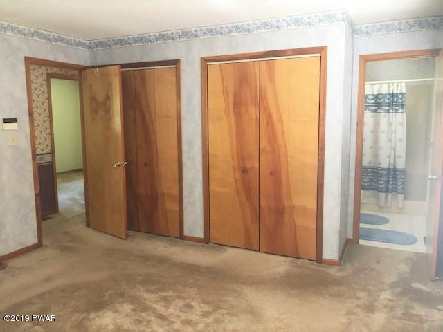 161 Tuthill Road Waymart, PA 18472 - Photo 14 of 31 a view of a porch with a wooden door