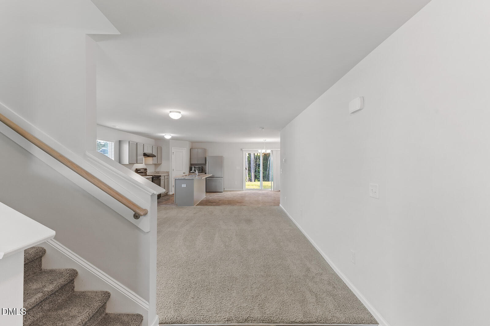 128 Maple Tree Lane Clayton, NC 27527 - Photo 3 of 14 a view of a livingroom with wooden floor and staircase