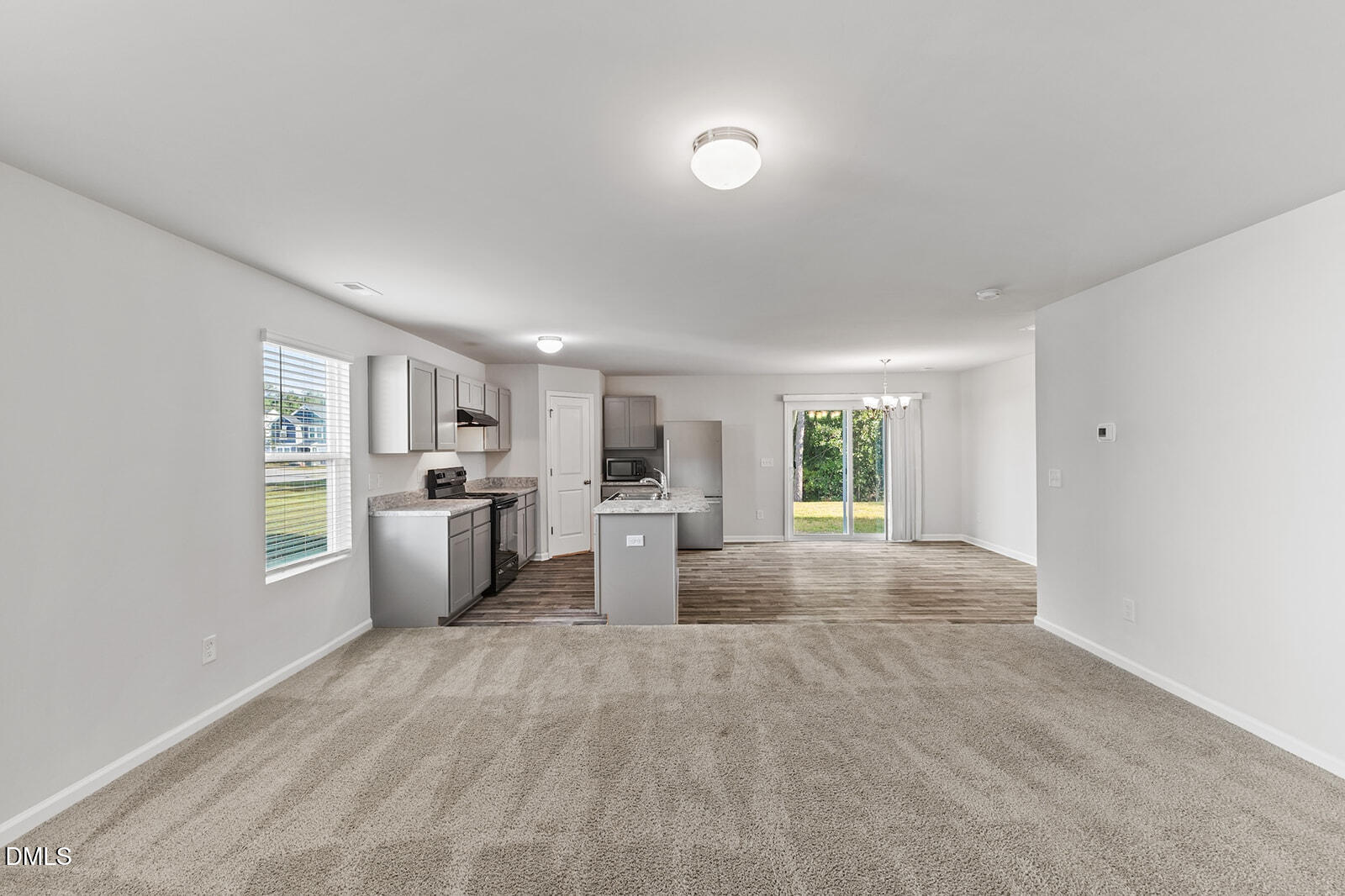 128 Maple Tree Lane Clayton, NC 27527 - Photo 4 of 14 a view of a living room a kitchen and a sink