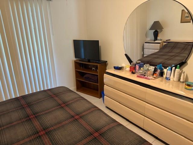 678 Durham, Unit 678 Deerfield Beach, FL 33442 - Photo 7 of 9 a living room with furniture and a flat screen tv