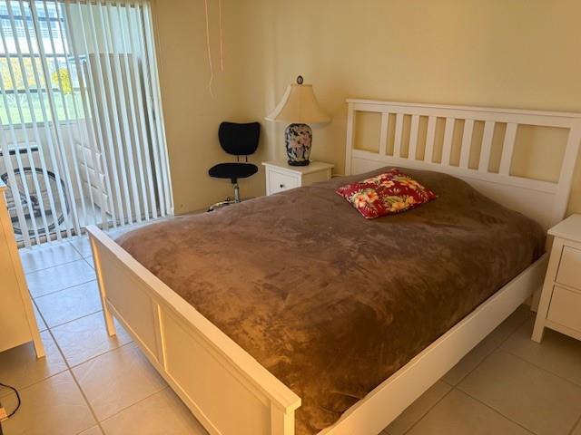 678 Durham, Unit 678 Deerfield Beach, FL 33442 - Photo 9 of 9 a bed sitting in a bedroom next to a window