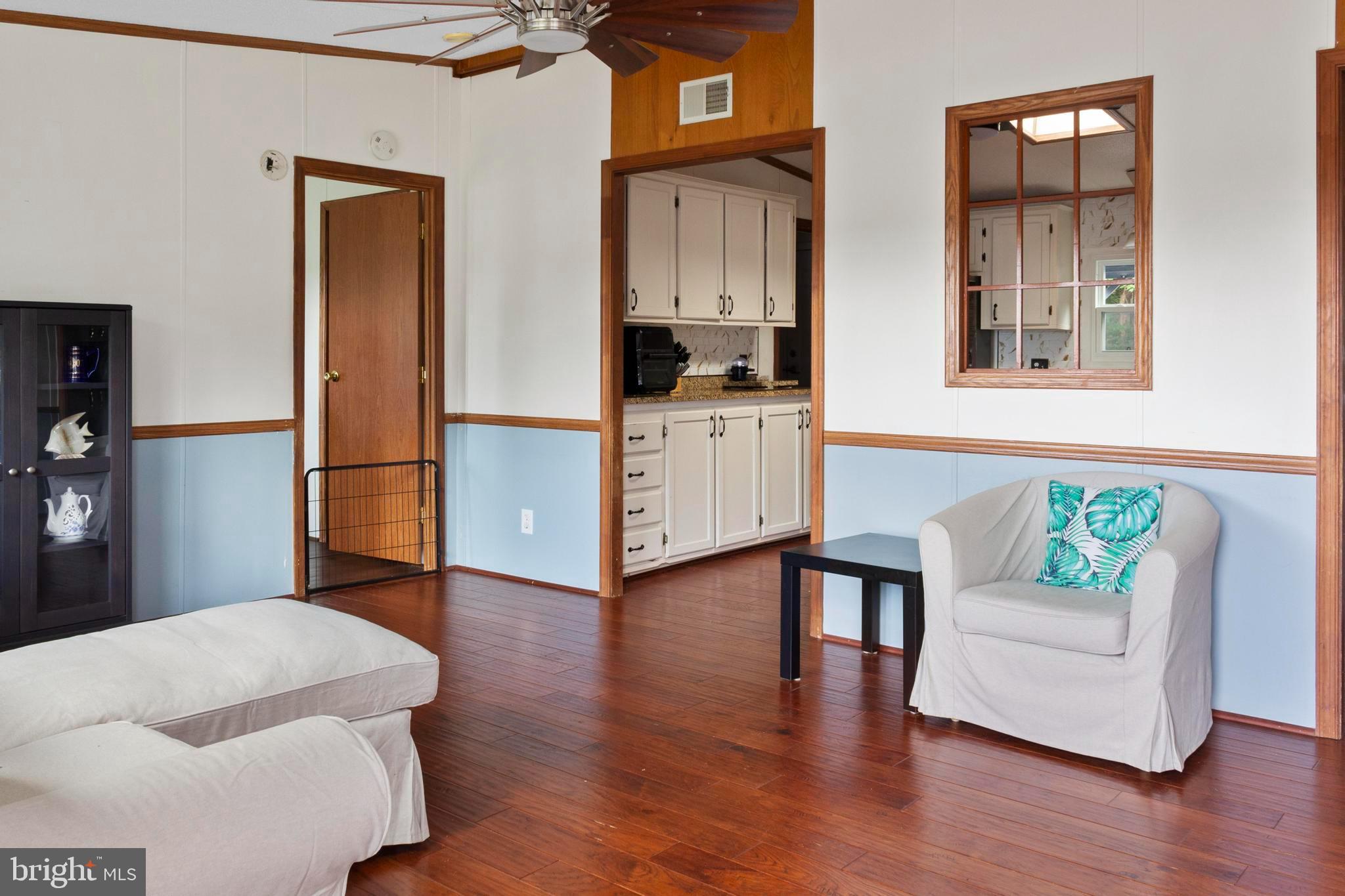 460 Sarah Anne Drive Lothian, MD 20711 - Photo 11 of 62 a living room with furniture and a wooden floor