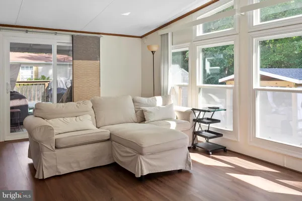a view of a deck with wooden floor and outdoor seating