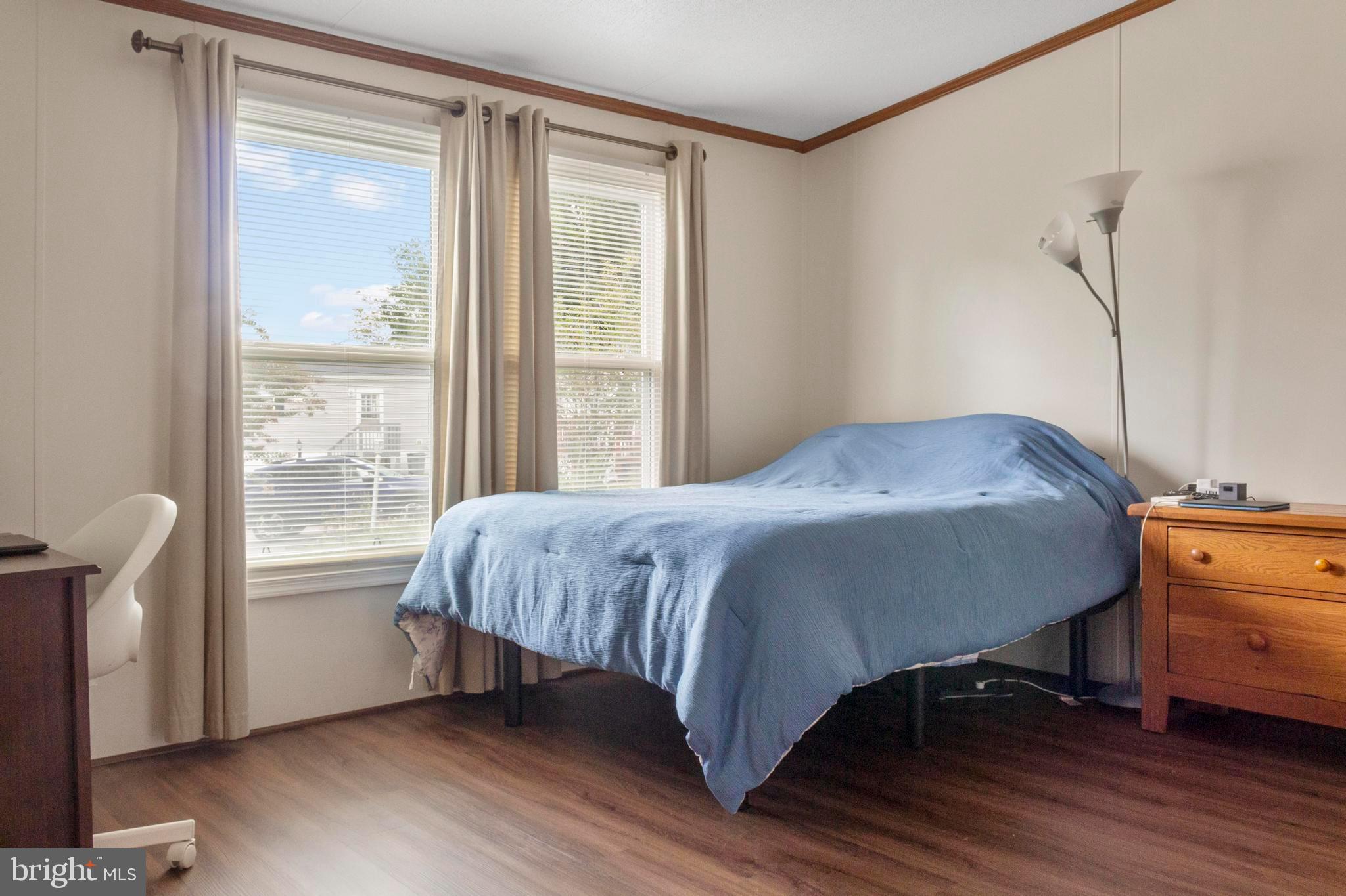 460 Sarah Anne Drive Lothian, MD 20711 - Photo 21 of 62 a bed sitting in a bedroom next to a window