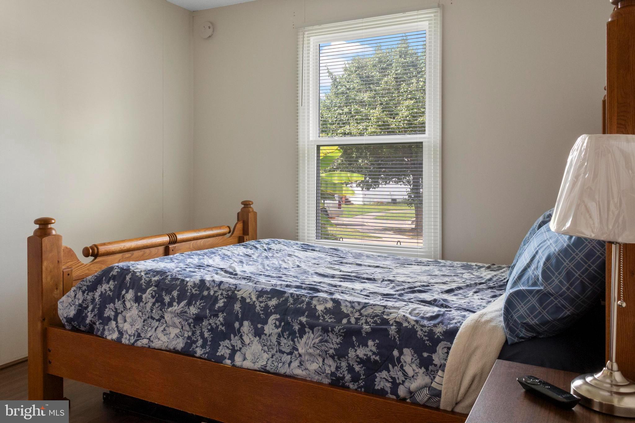 460 Sarah Anne Drive Lothian, MD 20711 - Photo 23 of 62 a bed sitting in a bedroom next to a window