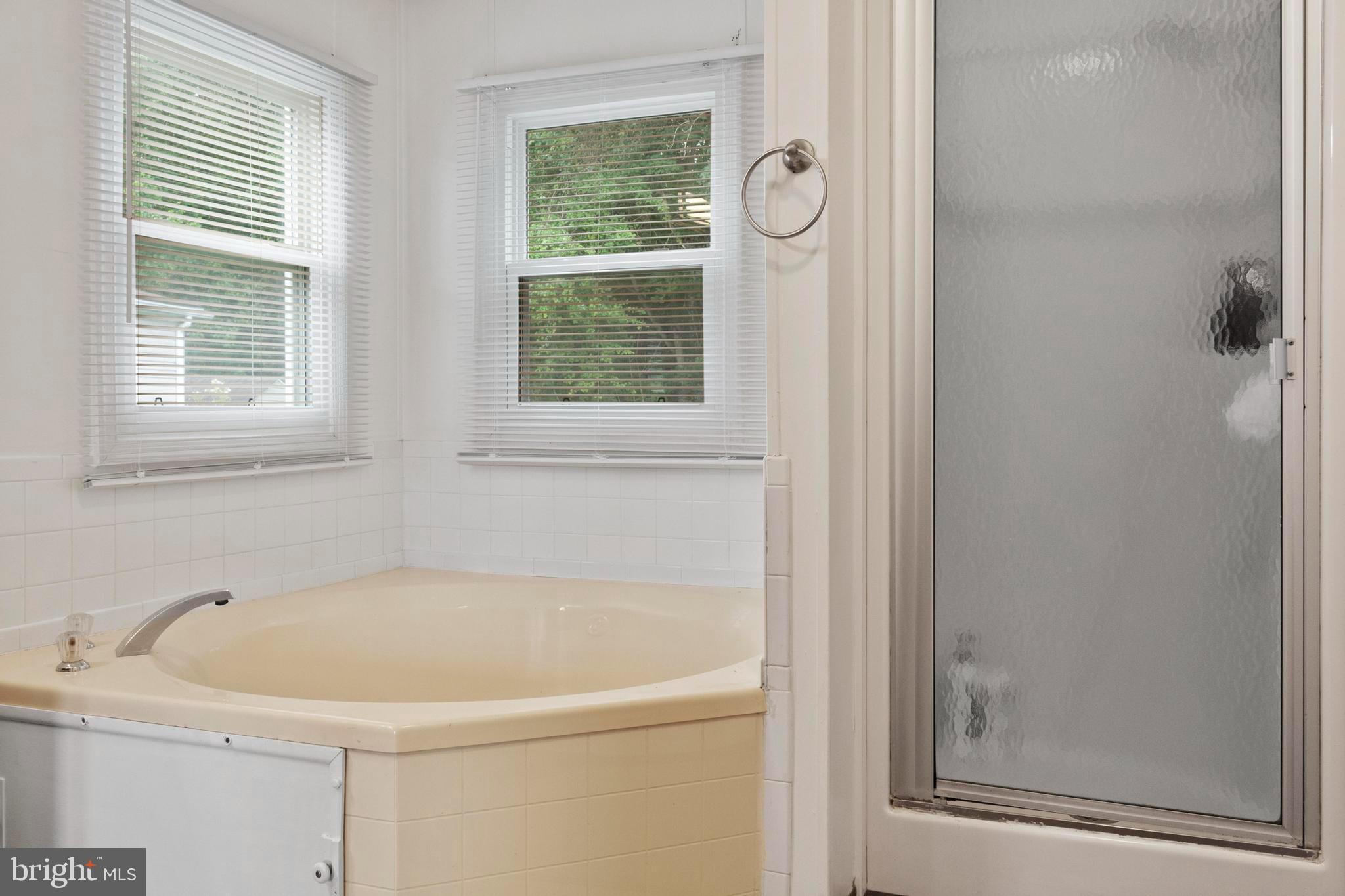 460 Sarah Anne Drive Lothian, MD 20711 - Photo 28 of 62 a white bath tub sitting next to a window