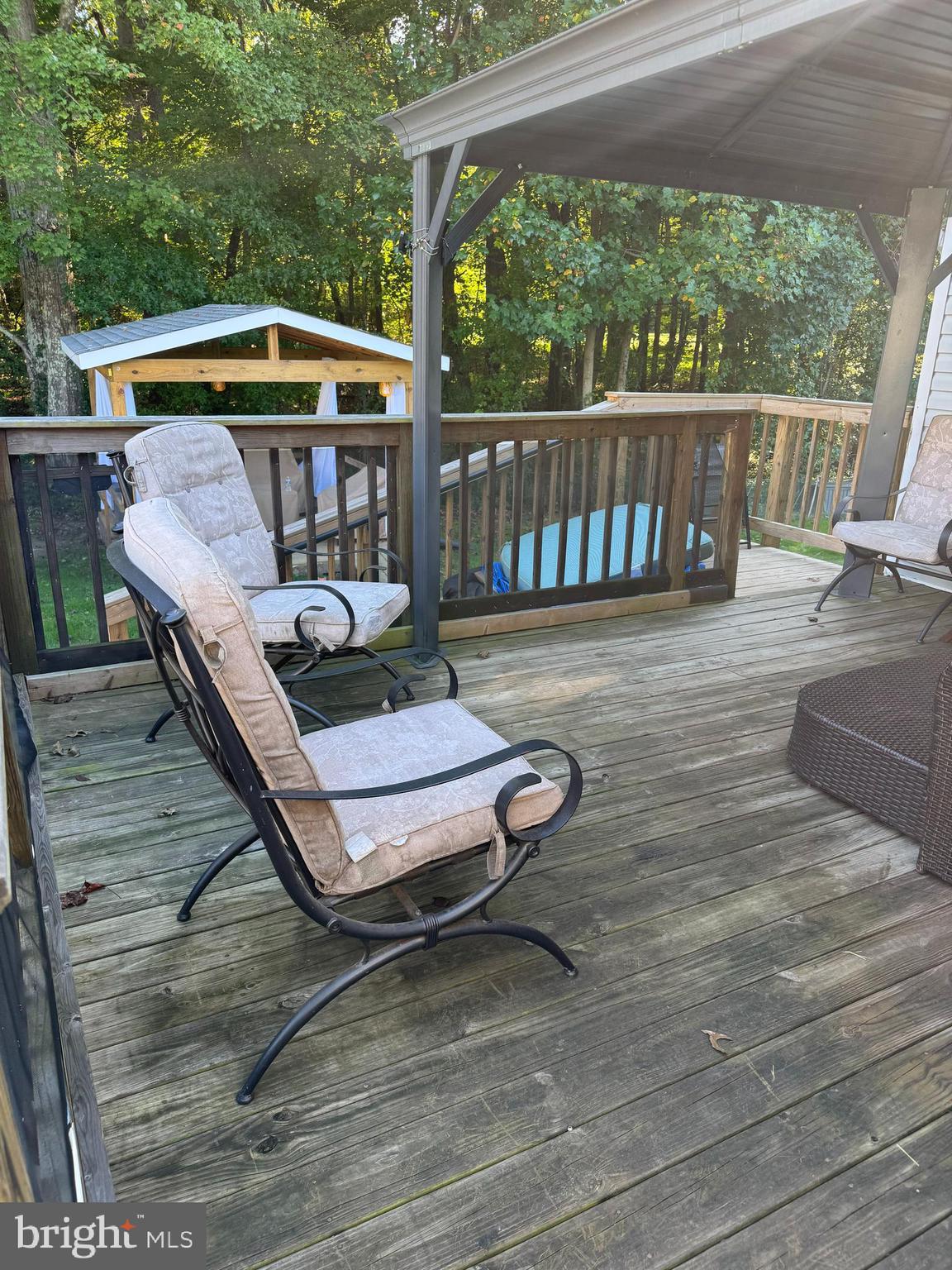 460 Sarah Anne Drive Lothian, MD 20711 - Photo 34 of 62 a view of a deck with wooden floor and outdoor seating