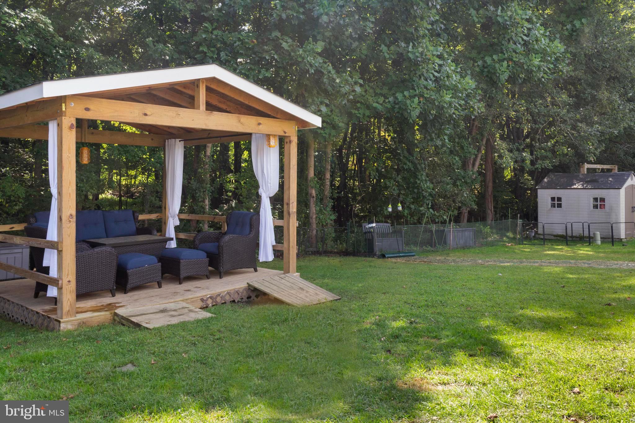 460 Sarah Anne Drive Lothian, MD 20711 - Photo 39 of 62 a view of a house with a yard porch and sitting area