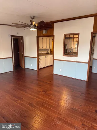 a large kitchen with stainless steel appliances granite countertop a stove a sink dishwasher and a refrigerator