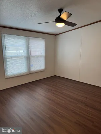 a view of a house with backyard and a garden