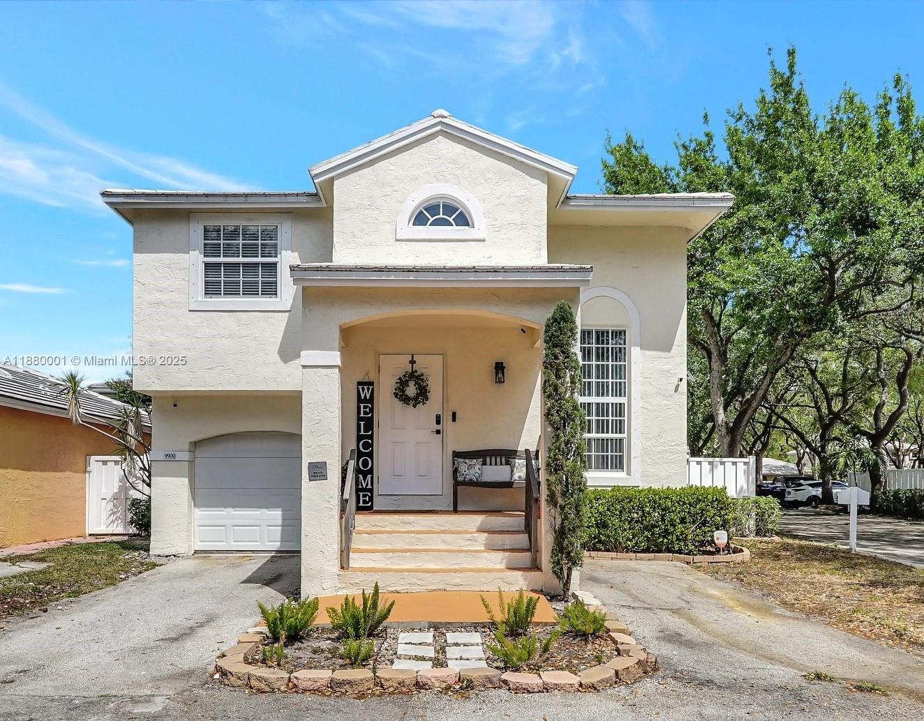 a front view of a house with garden