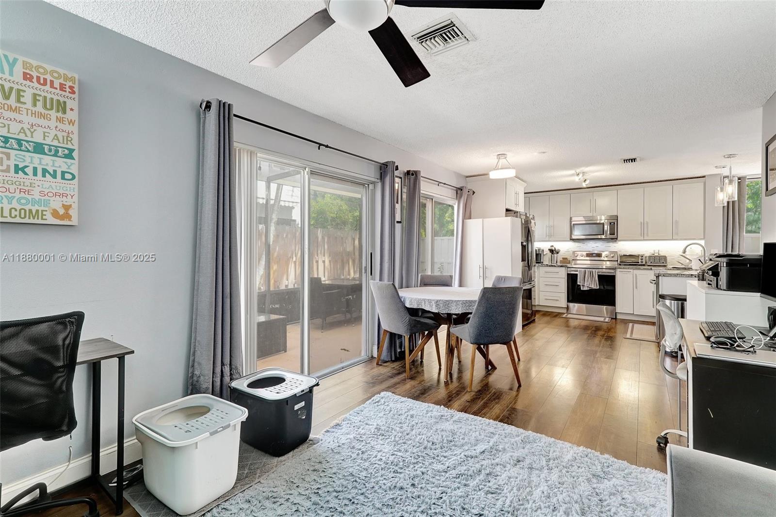 9900 Northwest 2nd Court Plantation, FL 33324 - Photo 16 of 56 a living room with furniture and a large window