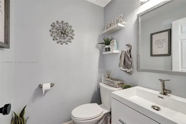 a bathroom with a toilet and a sink