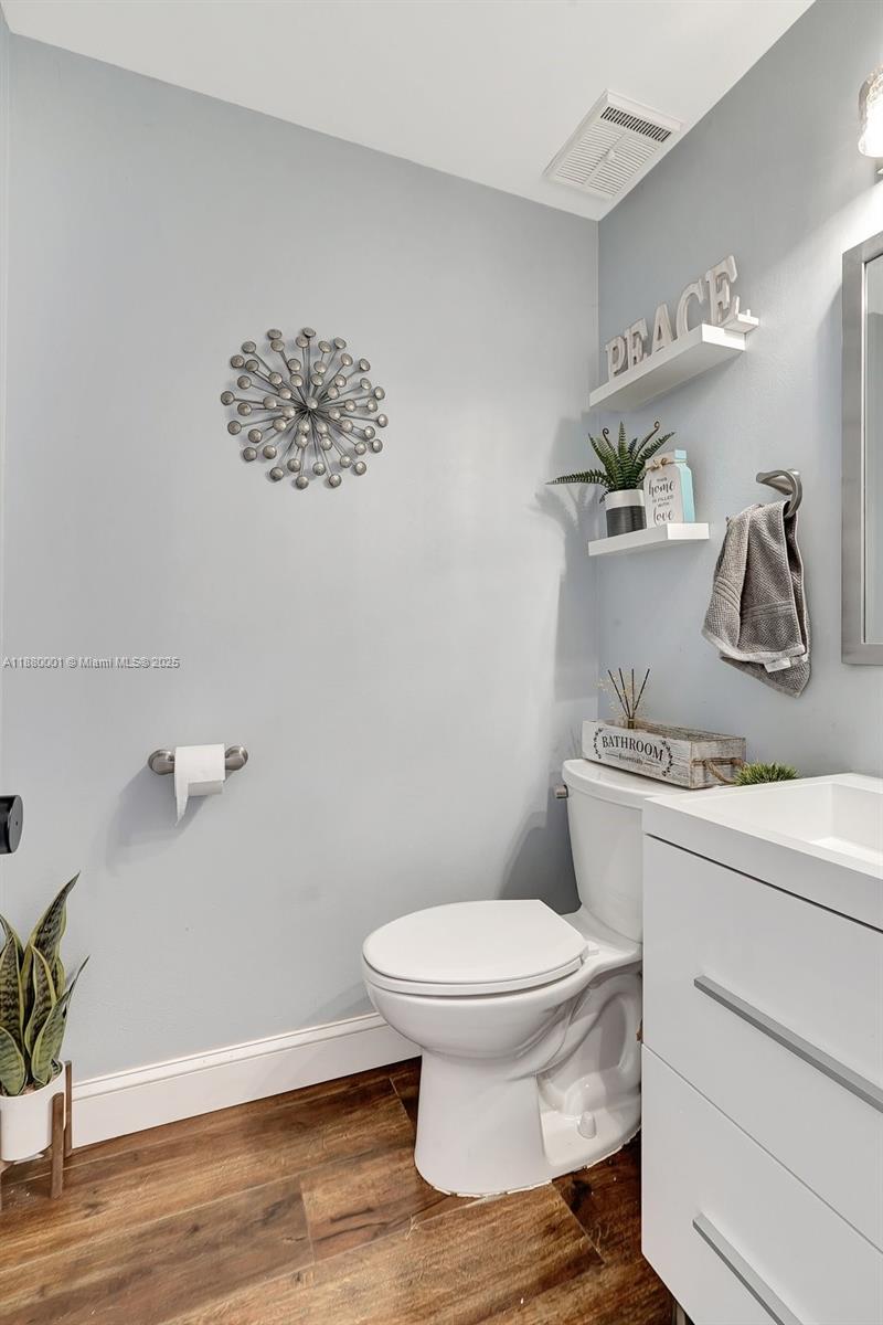 9900 Northwest 2nd Court Plantation, FL 33324 - Photo 18 of 56 a bathroom with a toilet and a sink