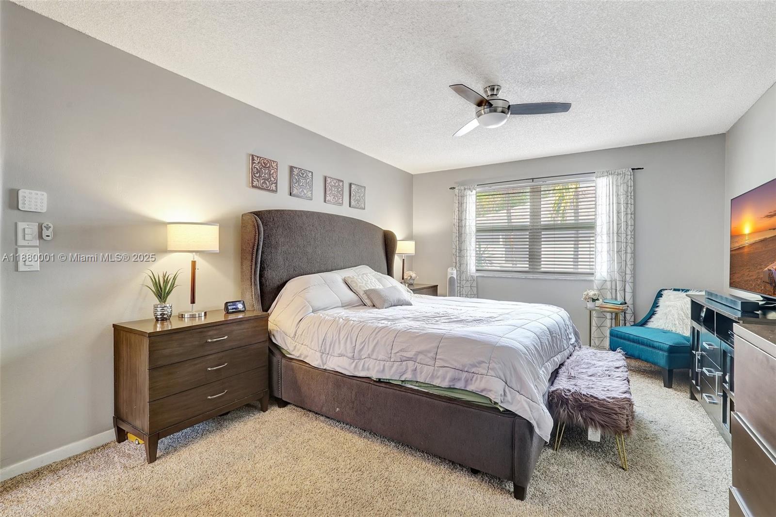 9900 Northwest 2nd Court Plantation, FL 33324 - Photo 21 of 56 a bedroom with a bed and a dresser next to a window