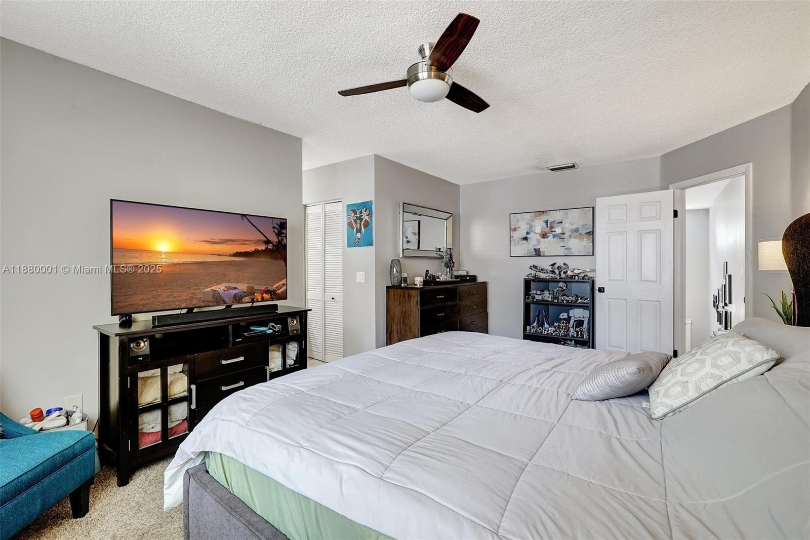 9900 Northwest 2nd Court Plantation, FL 33324 - Photo 23 of 56 a bedroom with a bed and a flat screen tv