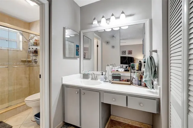 a spacious bathroom with a double vanity sink mirror and
