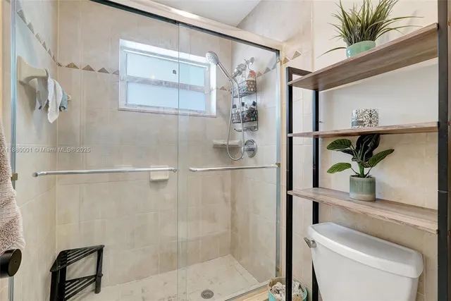 a view of a bathroom with a sink and mirror