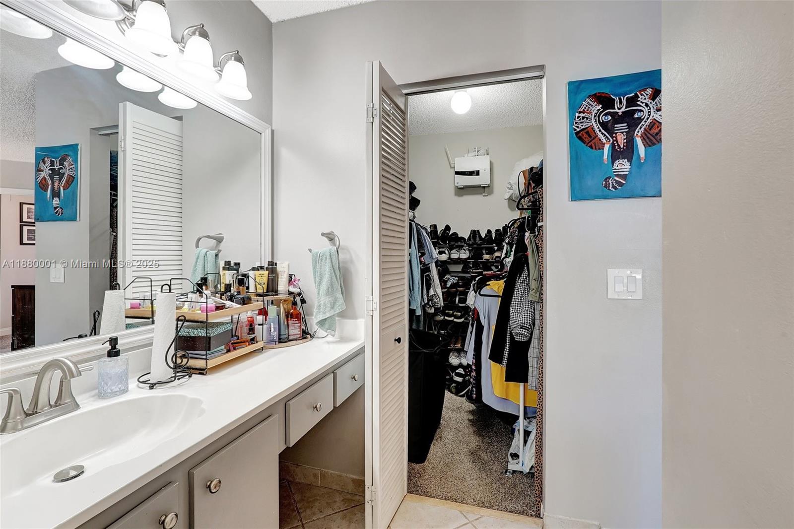 9900 Northwest 2nd Court Plantation, FL 33324 - Photo 27 of 56 a view of a bathroom with a sink and mirror