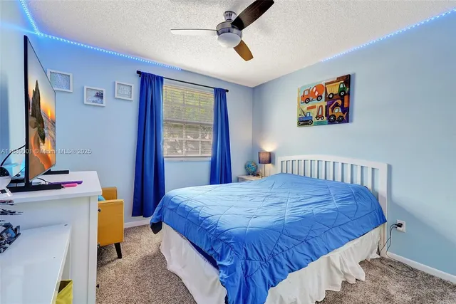 a bed room with a bed and mirror