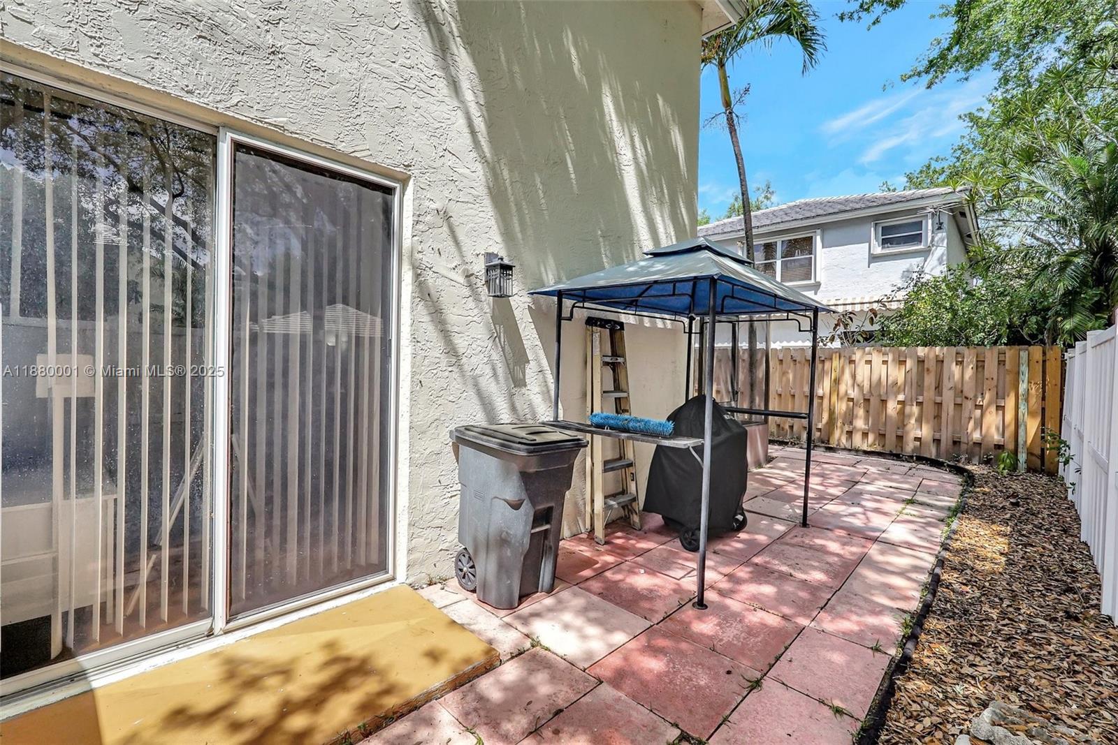 9900 Northwest 2nd Court Plantation, FL 33324 - Photo 36 of 56 a patio with table and chairs