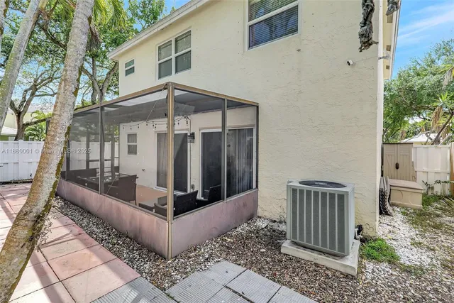 a living room with a couch and large windows