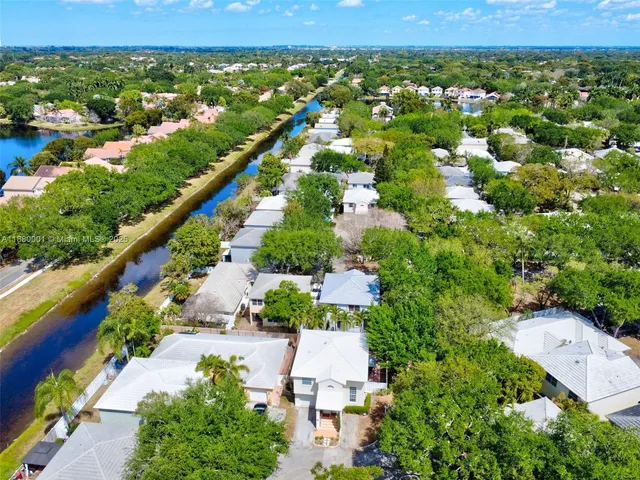 an aerial view of residential houses with city view