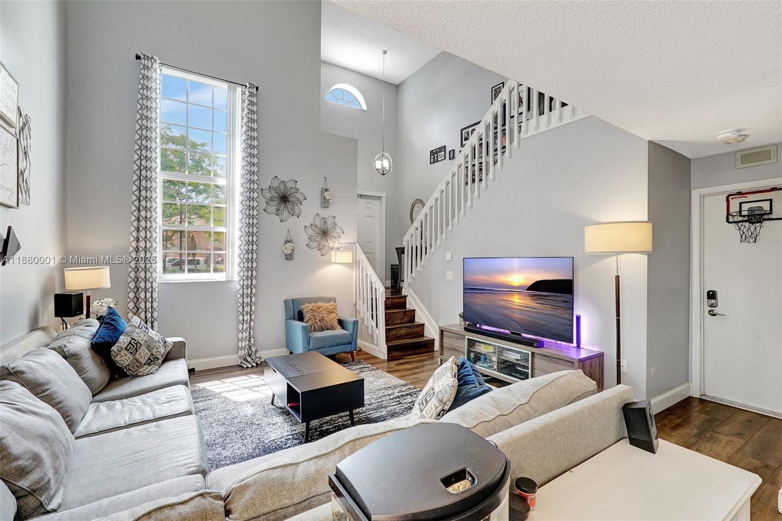 9900 Northwest 2nd Court Plantation, FL 33324 - Photo 8 of 56 a living room with furniture and a flat screen tv