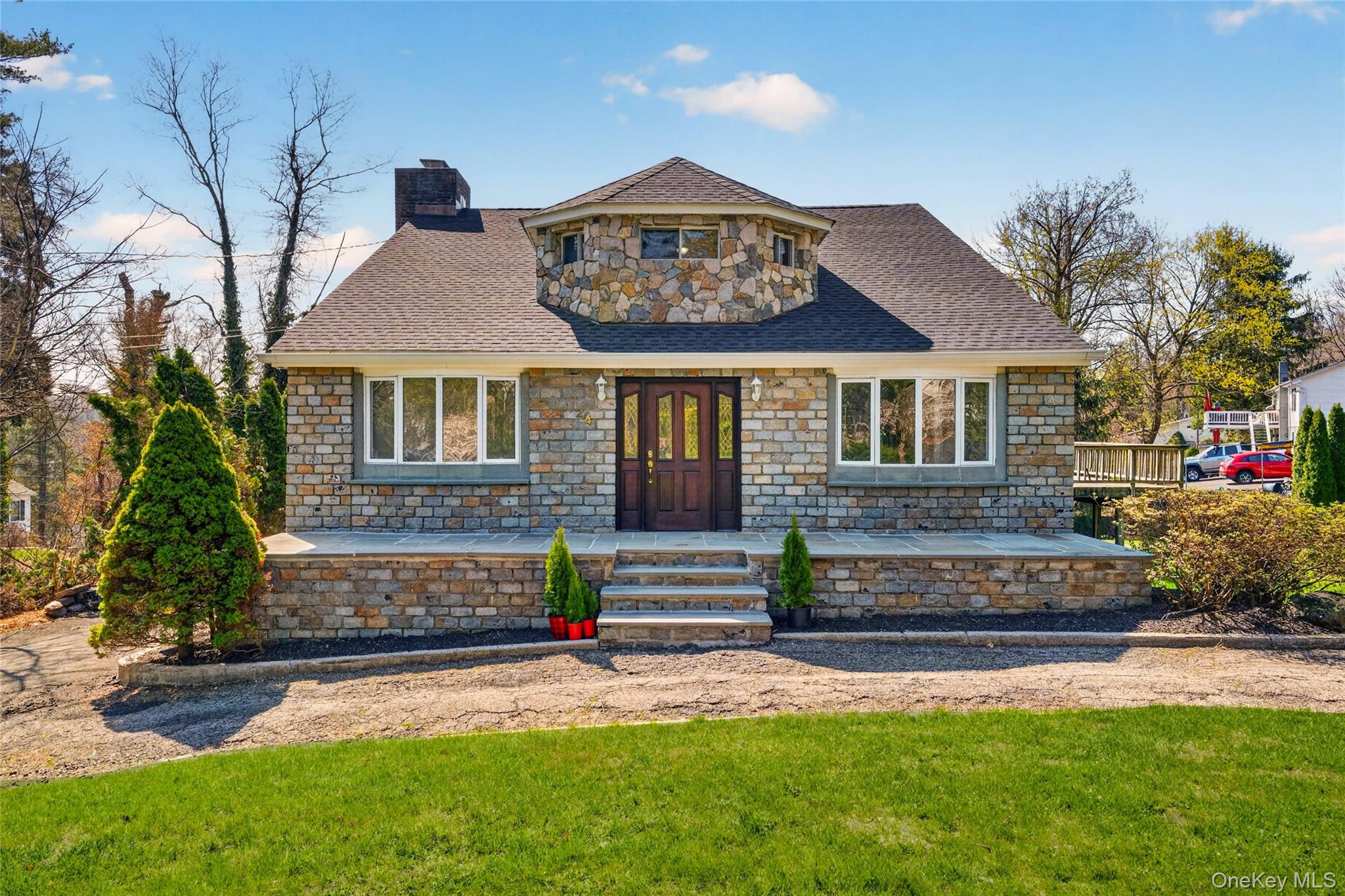 24 Old Knollwood Road White Plains, NY 10607 - Photo 1 of 49 a front view of a house with a garden