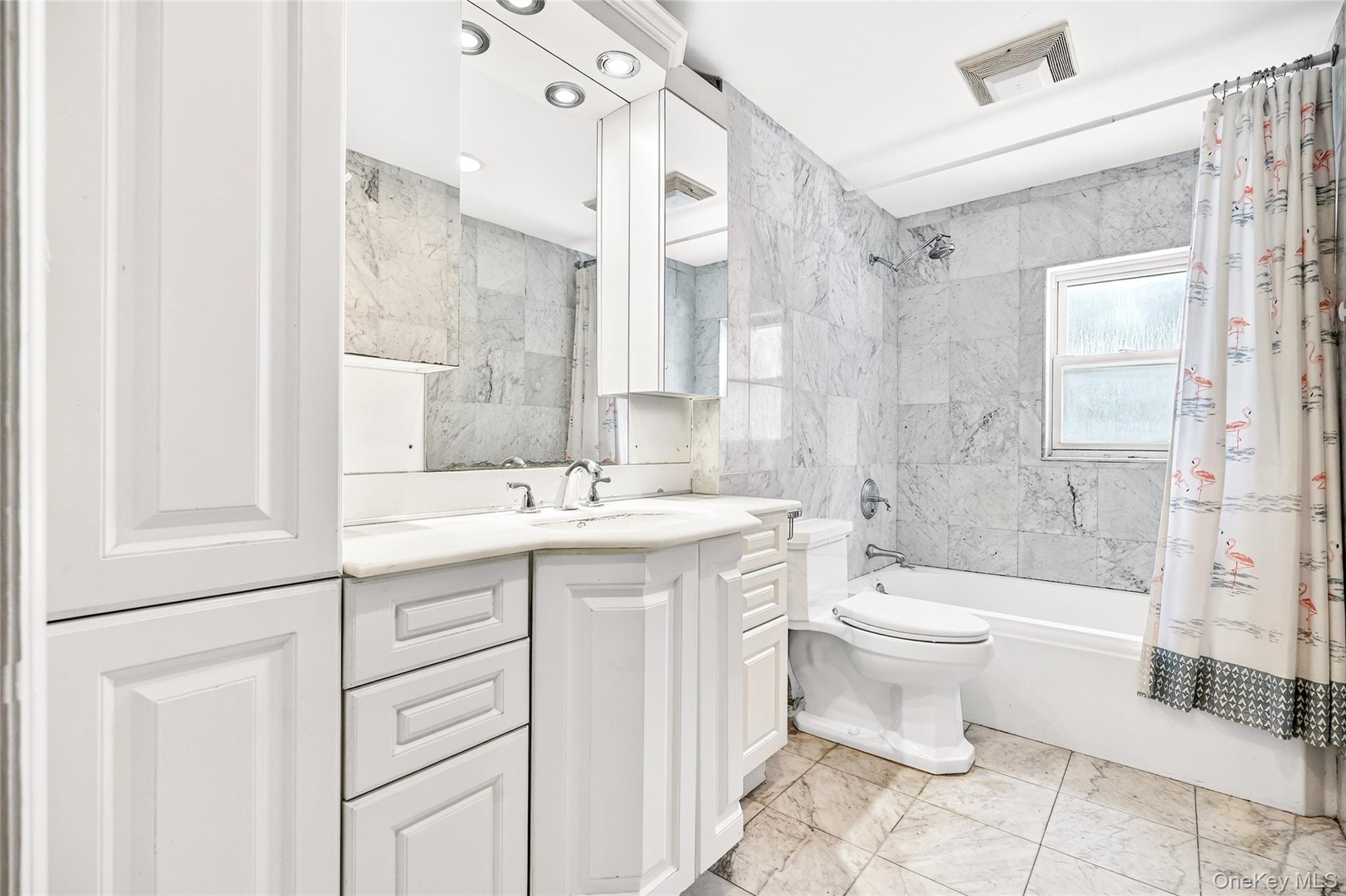 24 Old Knollwood Road White Plains, NY 10607 - Photo 14 of 49 a bathroom with a double vanity sink toilet and shower