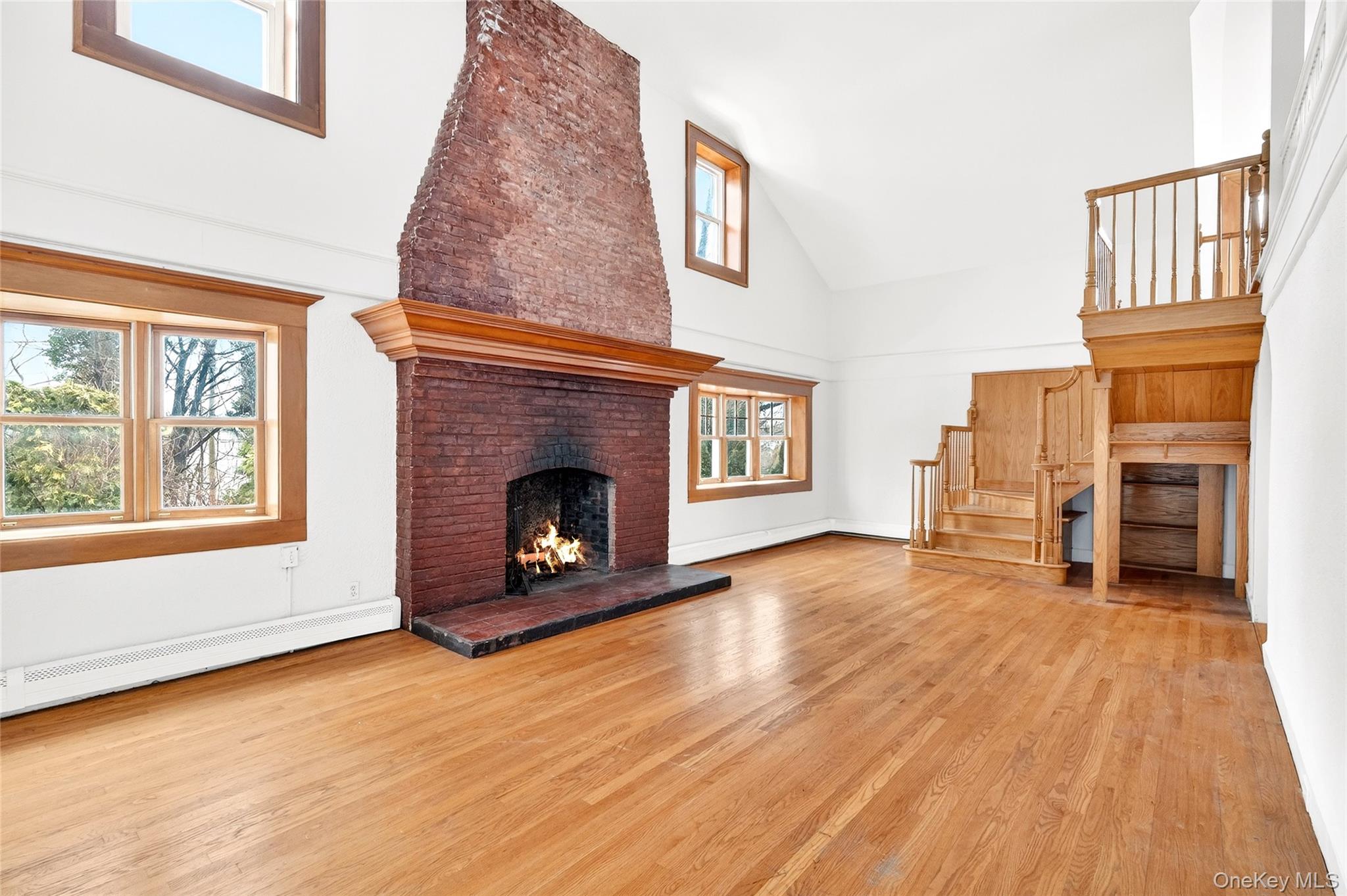 24 Old Knollwood Road White Plains, NY 10607 - Photo 2 of 49 a view of a livingroom with a fireplace and window