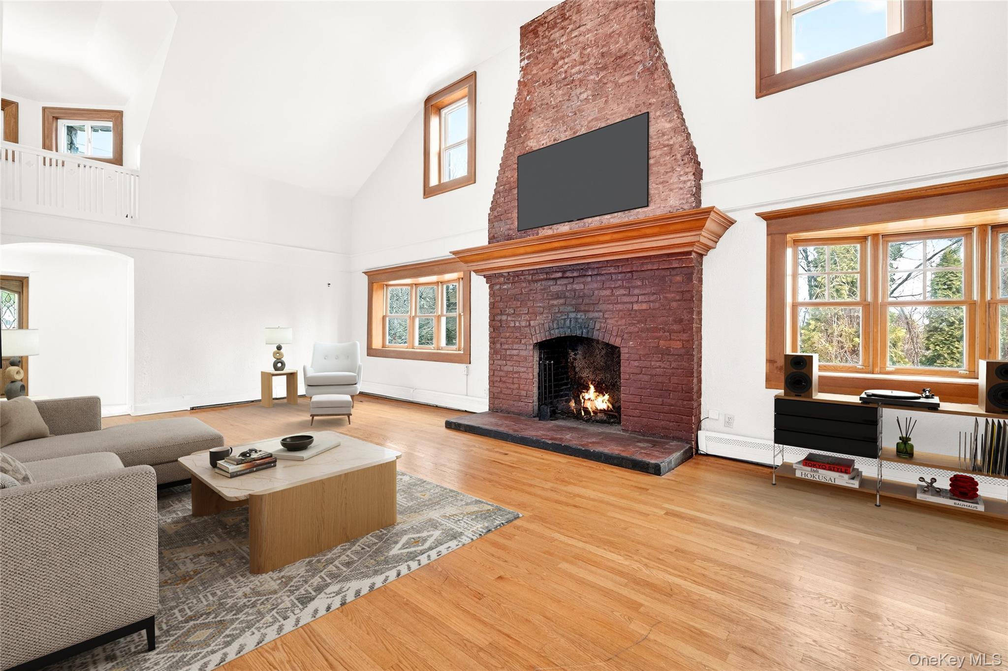 24 Old Knollwood Road White Plains, NY 10607 - Photo 3 of 49 a living room with furniture a fireplace and a flat screen tv