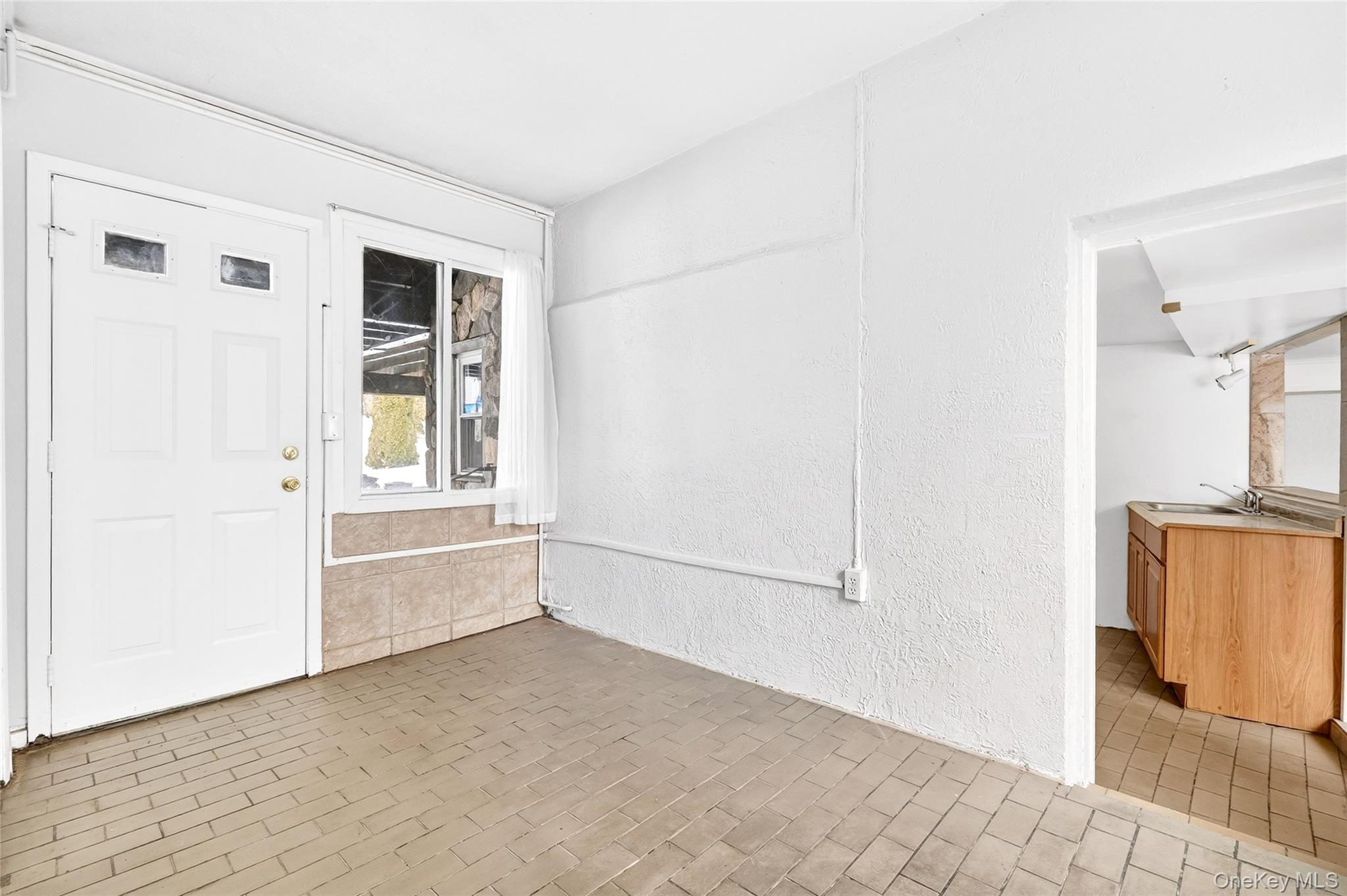 24 Old Knollwood Road White Plains, NY 10607 - Photo 32 of 49 a view of an empty room with window and cabinet