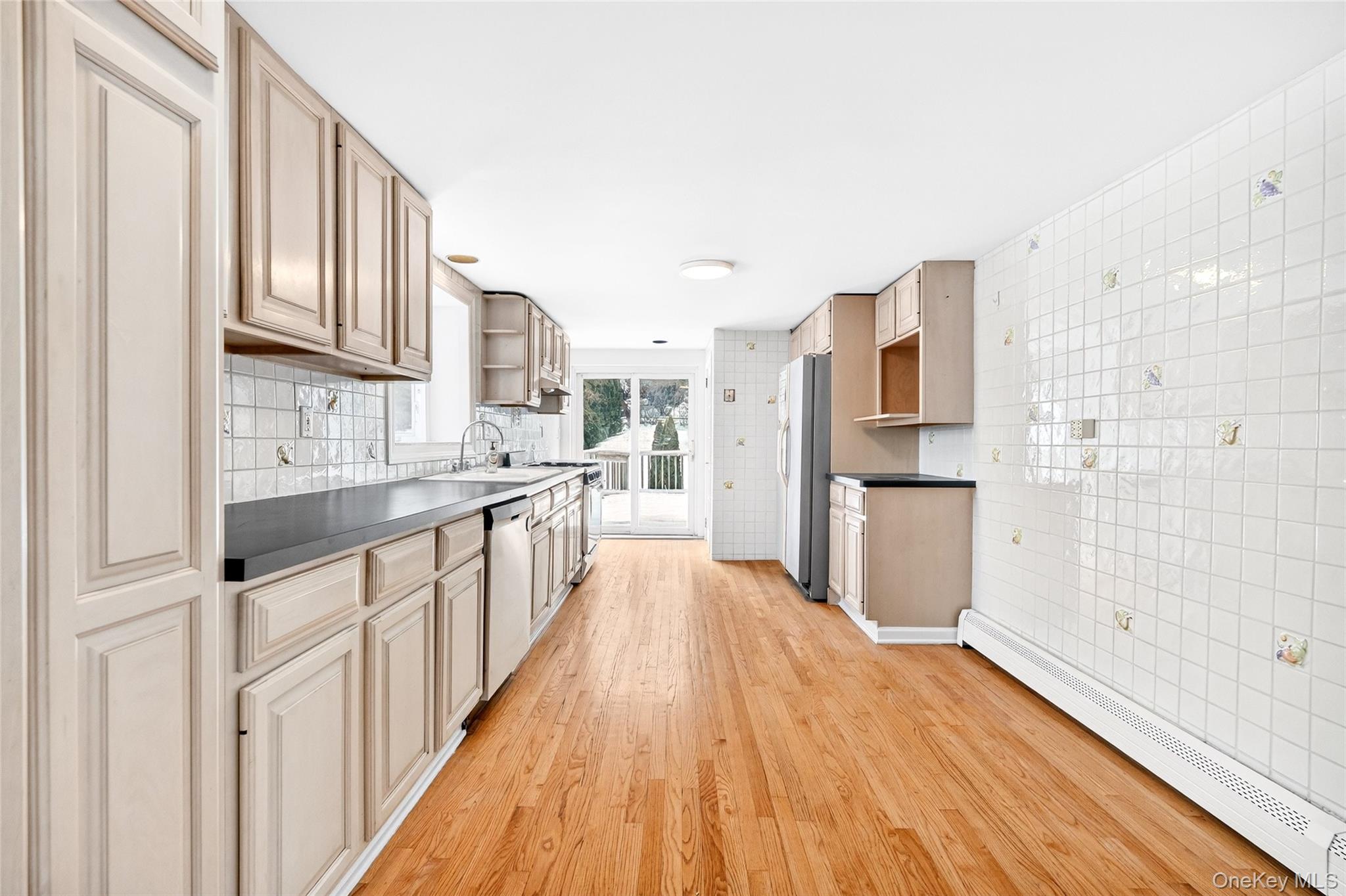 24 Old Knollwood Road White Plains, NY 10607 - Photo 5 of 49 a large kitchen with stainless steel appliances granite countertop a lot of counter space and wooden floor
