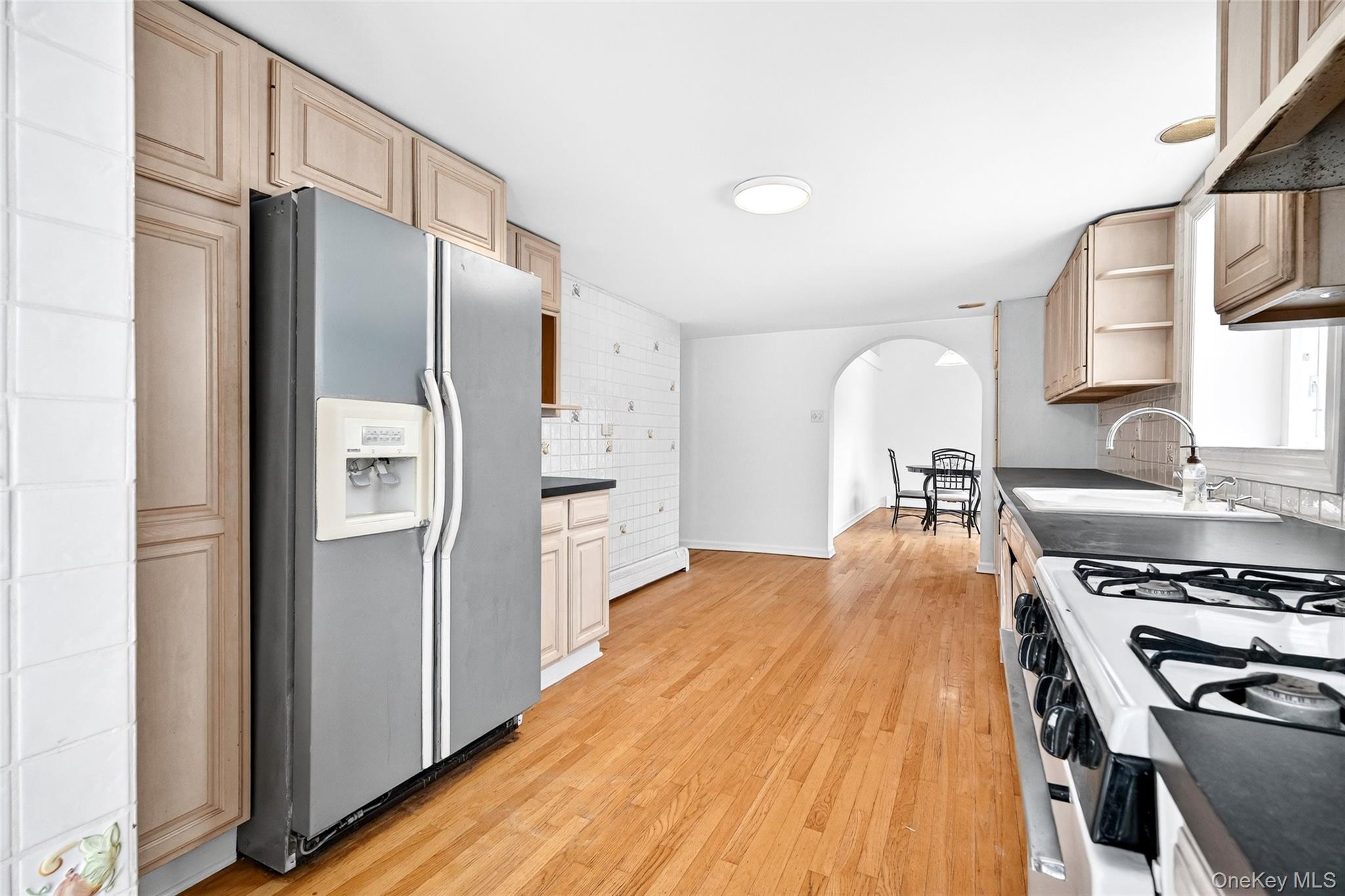 24 Old Knollwood Road White Plains, NY 10607 - Photo 7 of 49 a kitchen with stainless steel appliances a refrigerator a stove and a sink