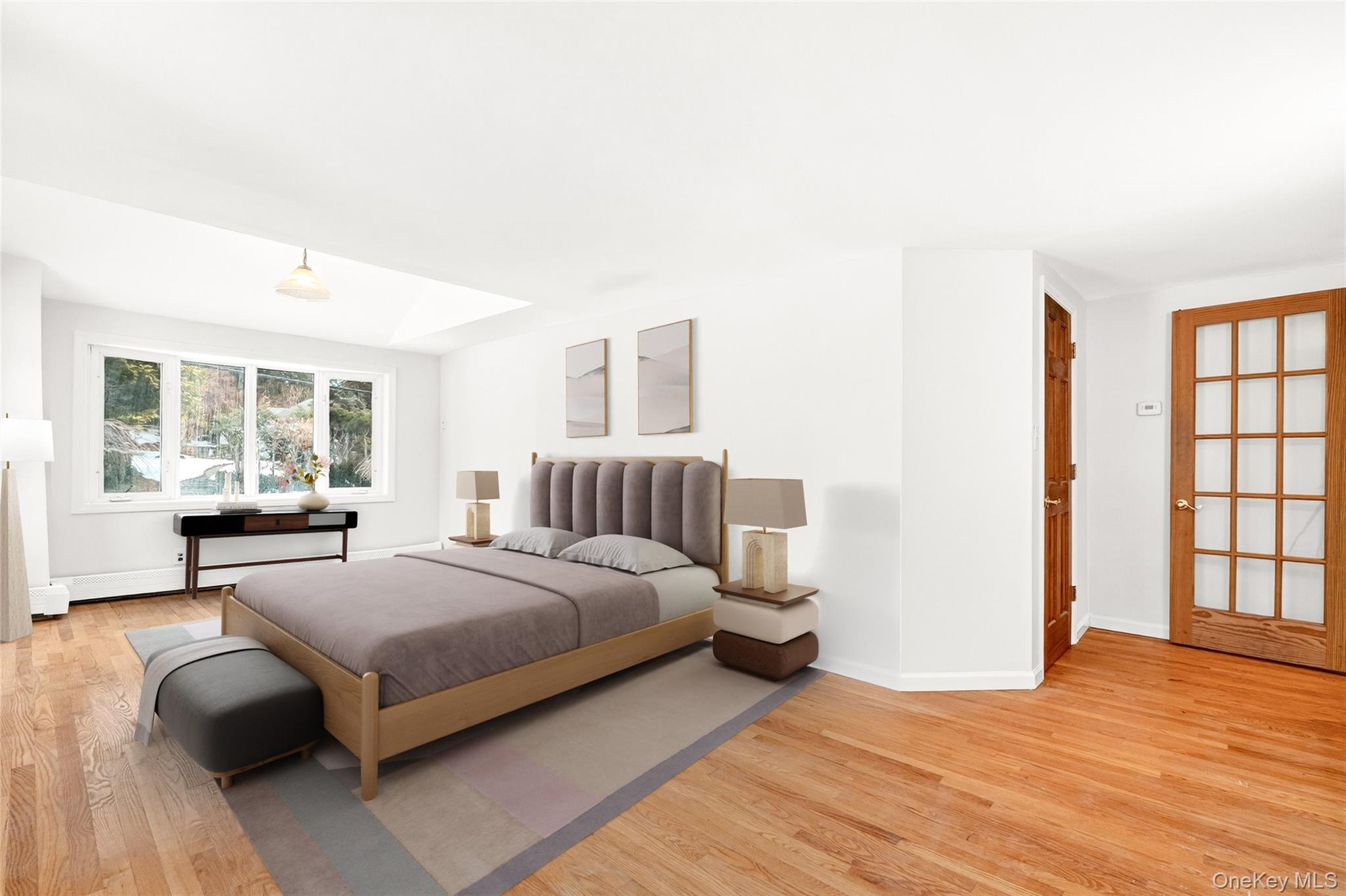 24 Old Knollwood Road White Plains, NY 10607 - Photo 10 of 49 a bedroom with a bed and wooden floor