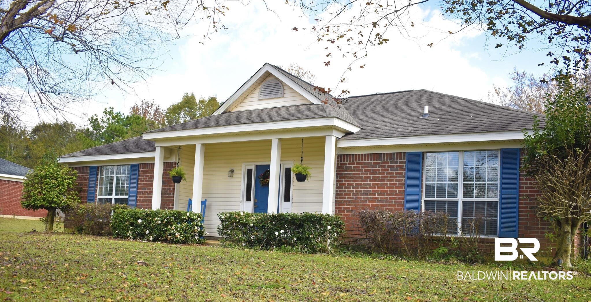 2355 Indian Ridge Estates Drive Mobile, AL 36695 - Photo 2 of 2 View of front of home with covered porch, brick siding, a front yard, and a shingled roof
