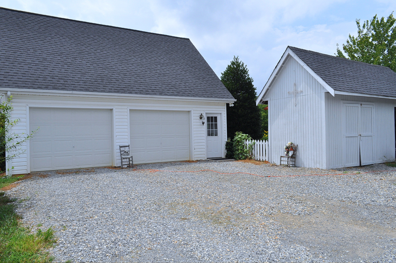 1167 Factory Hill Road Callaway, VA 24067 - Photo 15 of 80 a view of a house with a yard and garage