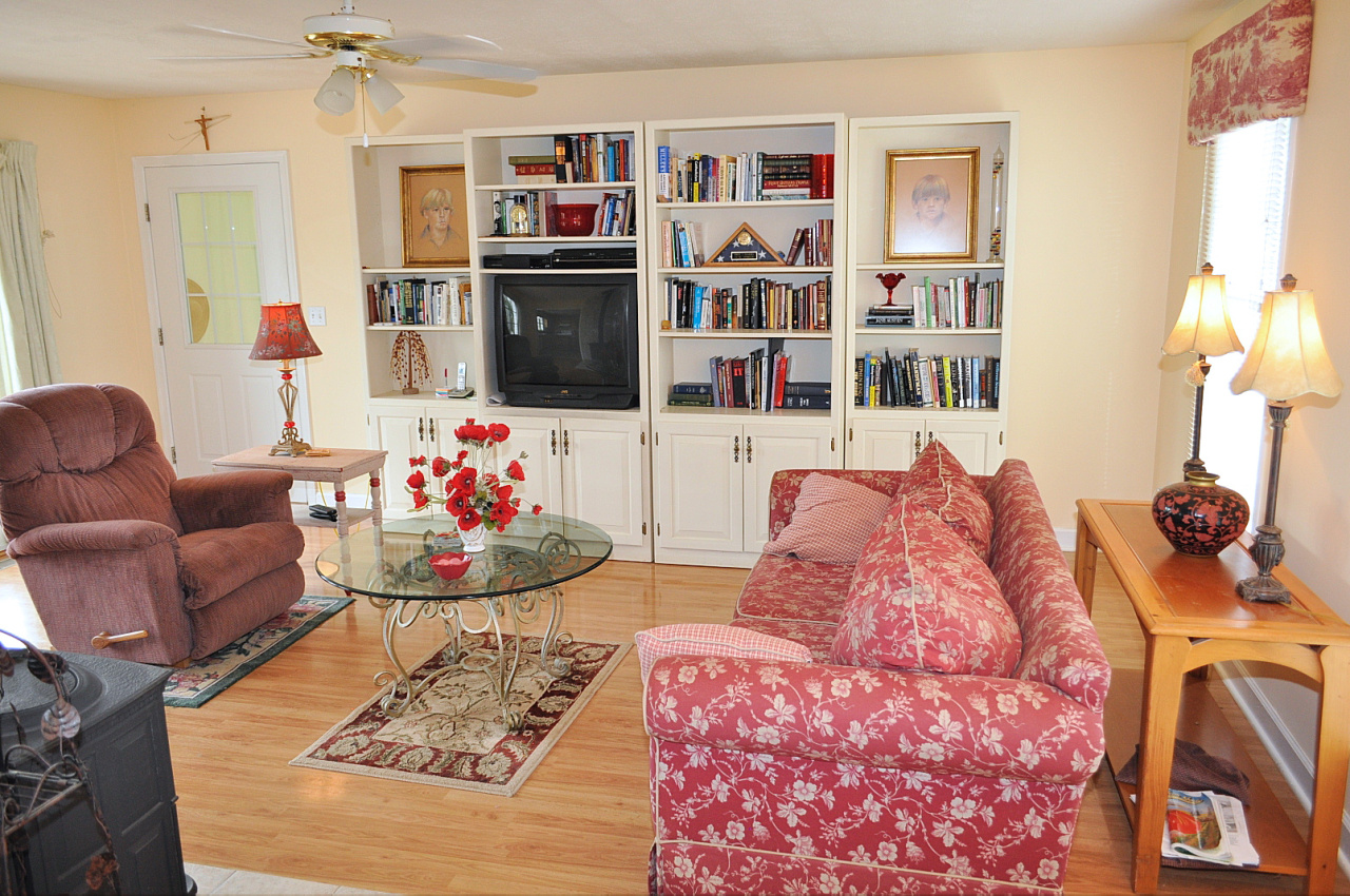 1167 Factory Hill Road Callaway, VA 24067 - Photo 29 of 80 a living room with furniture and a book shelf