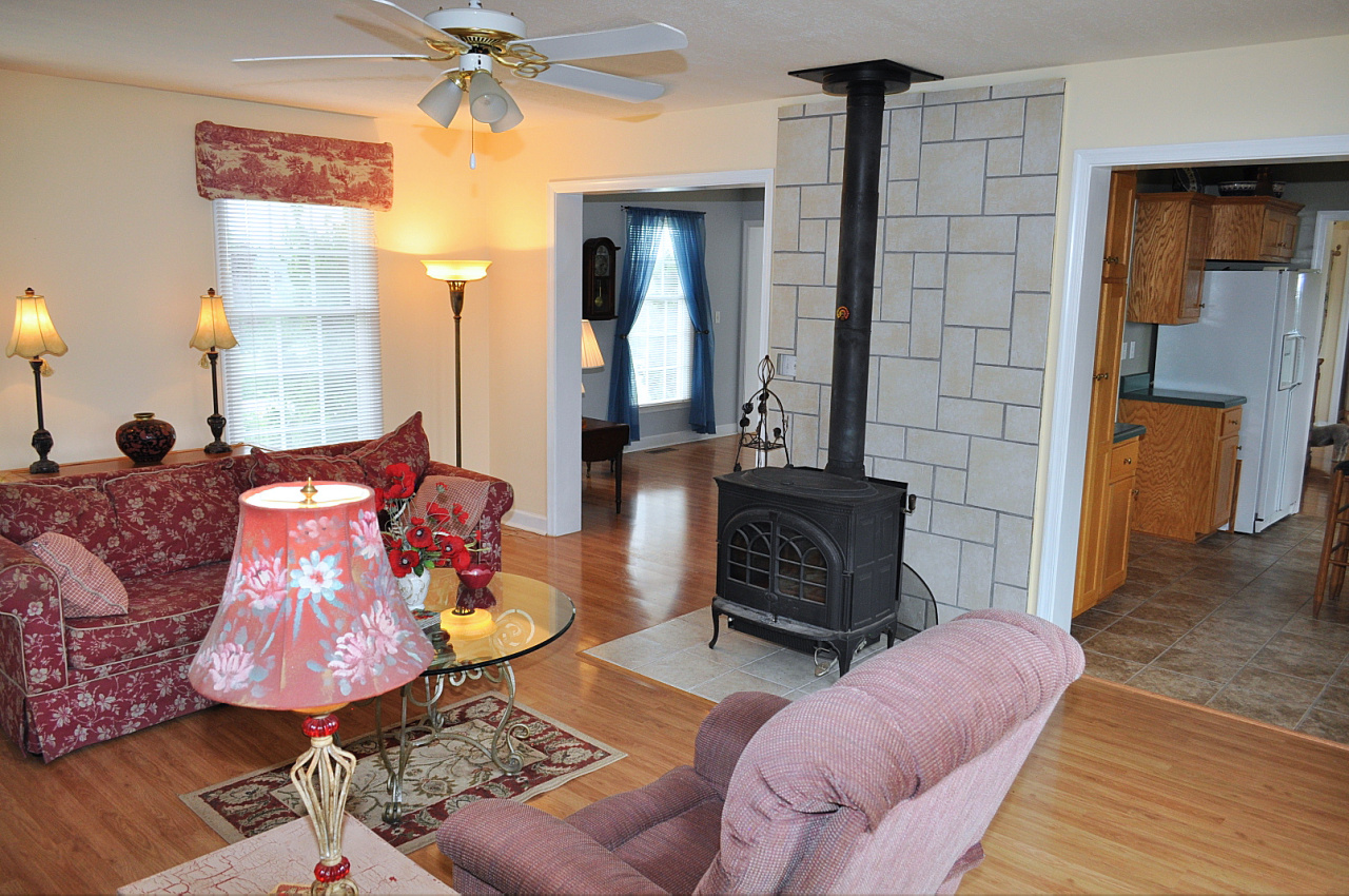 1167 Factory Hill Road Callaway, VA 24067 - Photo 31 of 80 a living room with furniture and a fireplace