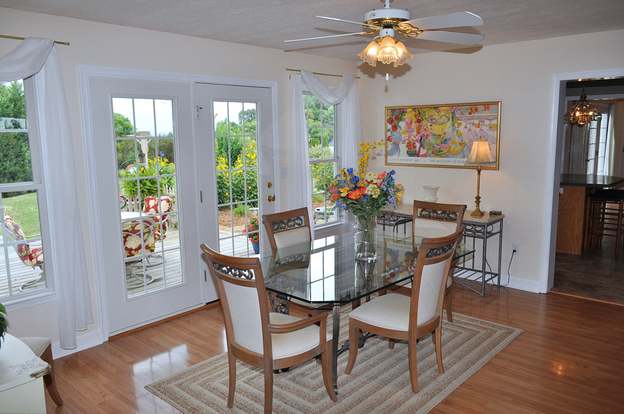 1167 Factory Hill Road Callaway, VA 24067 - Photo 41 of 80 a dining room with furniture a chandelier and wooden floor