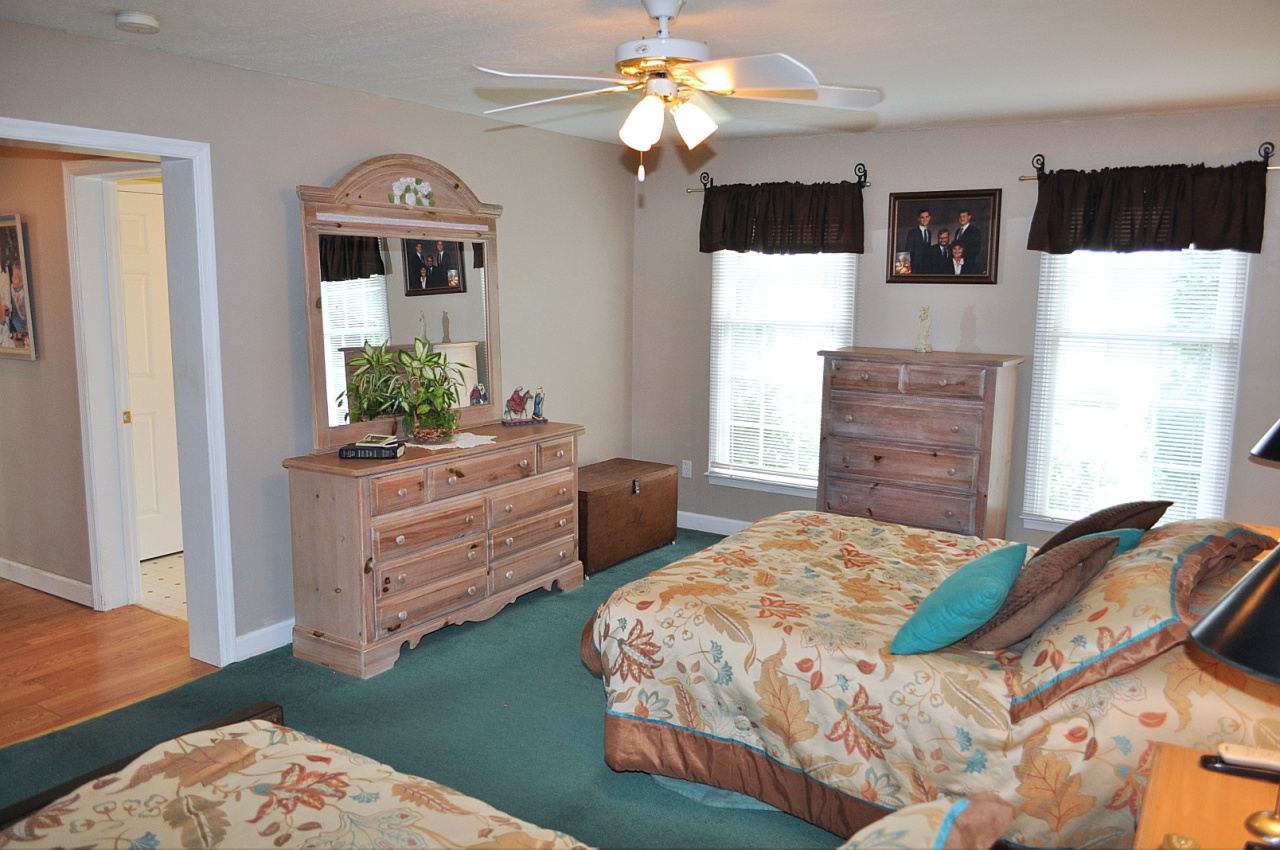 1167 Factory Hill Road Callaway, VA 24067 - Photo 47 of 80 a bedroom with a bed a dresser and a window