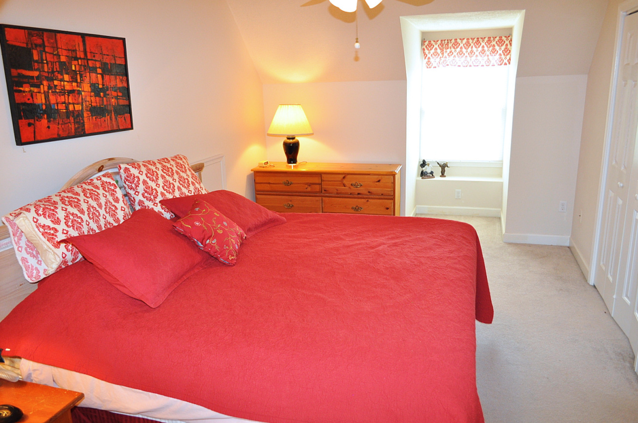 1167 Factory Hill Road Callaway, VA 24067 - Photo 64 of 80 a bedroom with a bed and a painting on the wall