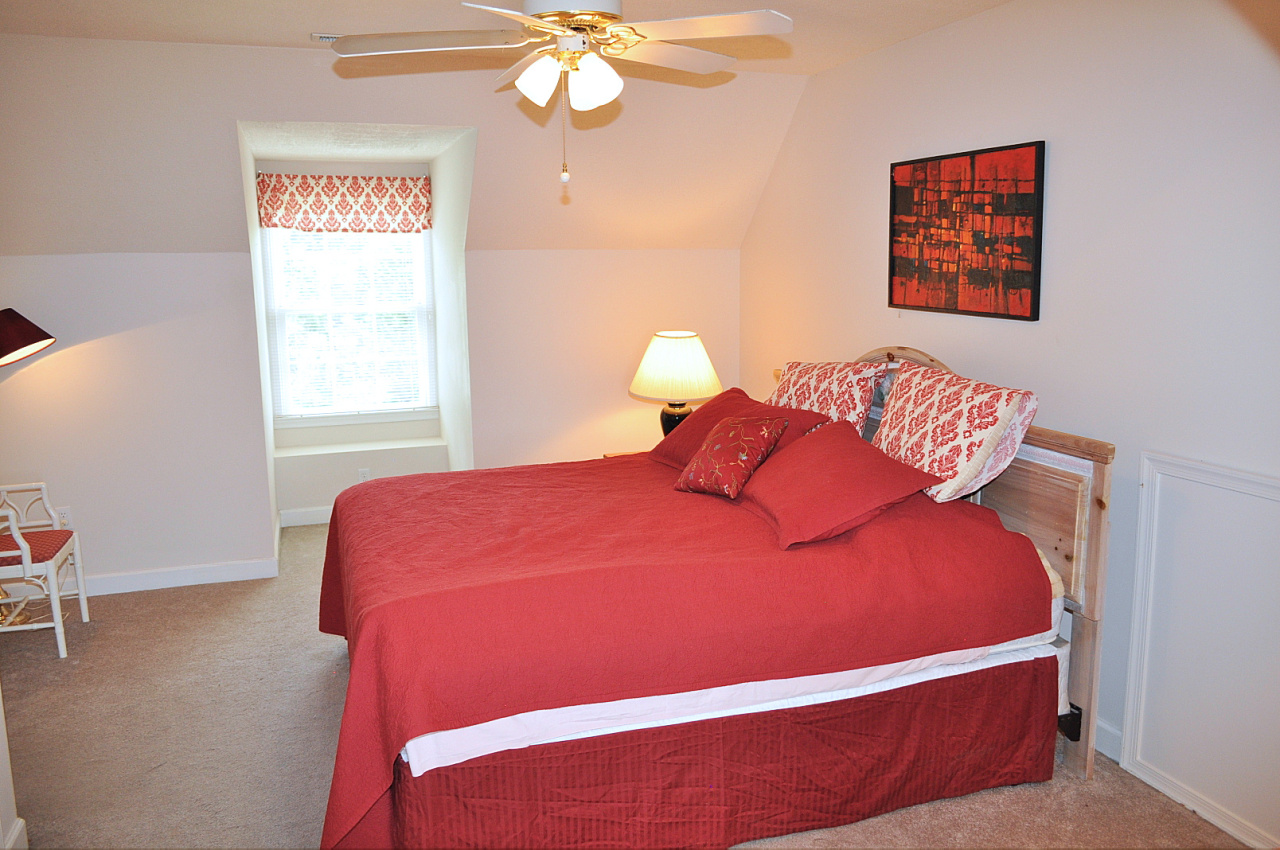 1167 Factory Hill Road Callaway, VA 24067 - Photo 66 of 80 a blue bed sitting in a bedroom next to a window