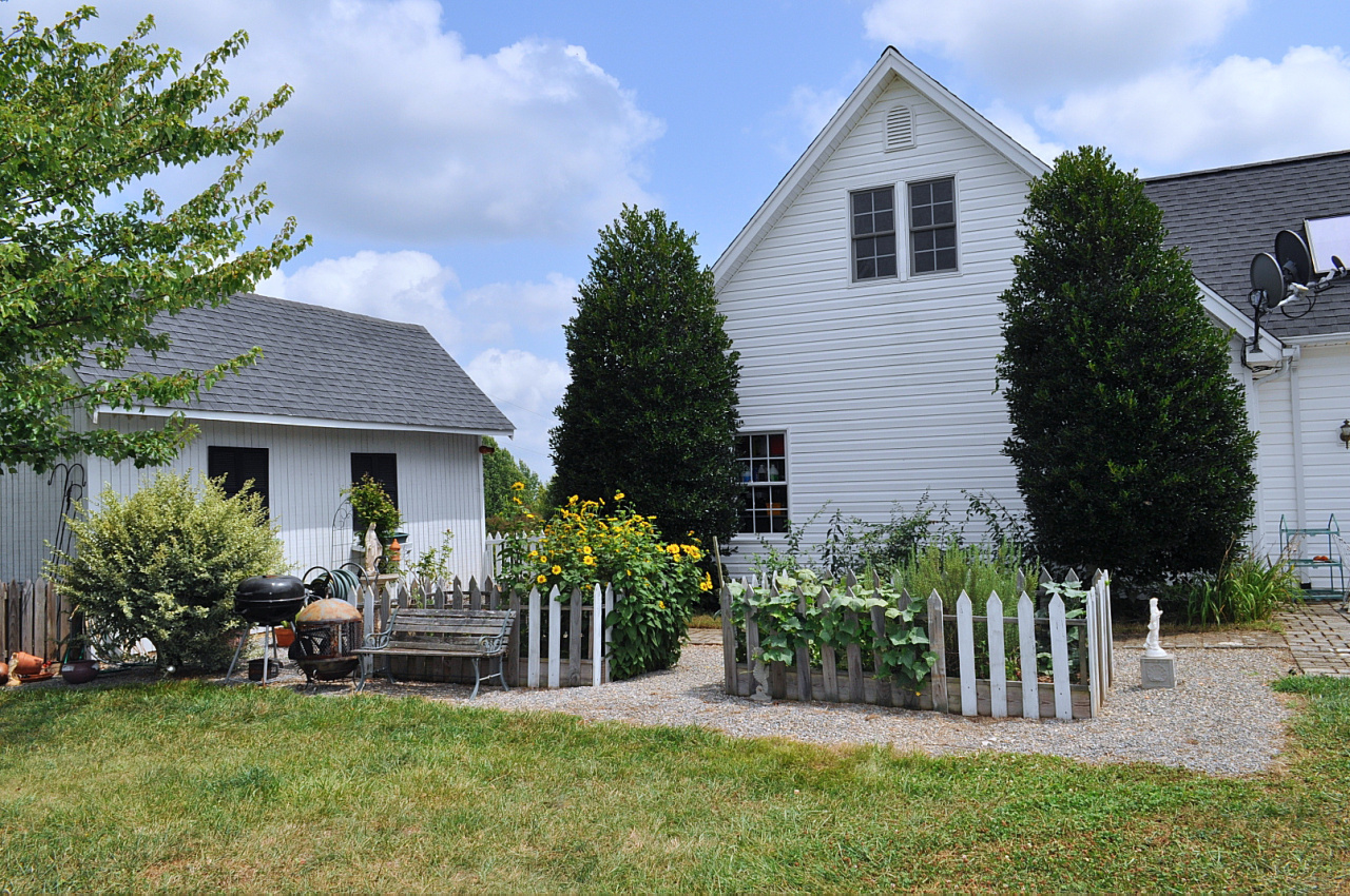 1167 Factory Hill Road Callaway, VA 24067 - Photo 8 of 80 a front view of a house with a garden