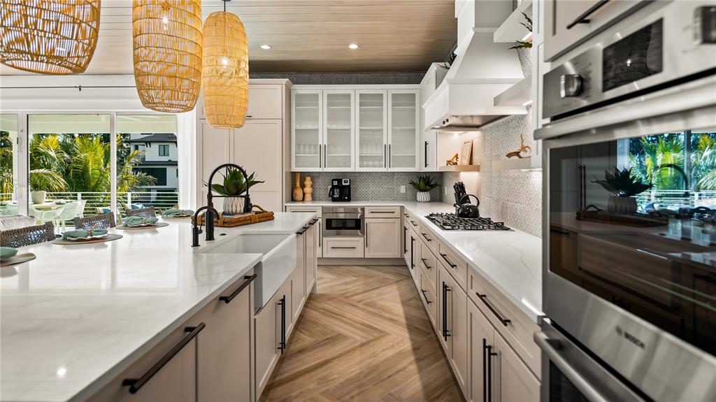 6536 Peacock Road Sarasota, FL 34242 - Photo 18 of 82 a large kitchen with stainless steel appliances granite countertop a lot of counter space