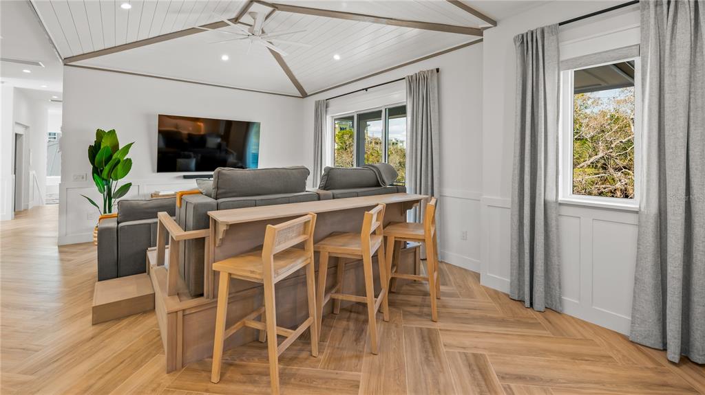 6536 Peacock Road Sarasota, FL 34242 - Photo 23 of 82 a dining room with furniture window and wooden floor