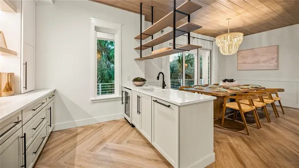 a view of balcony with wooden floor and fence