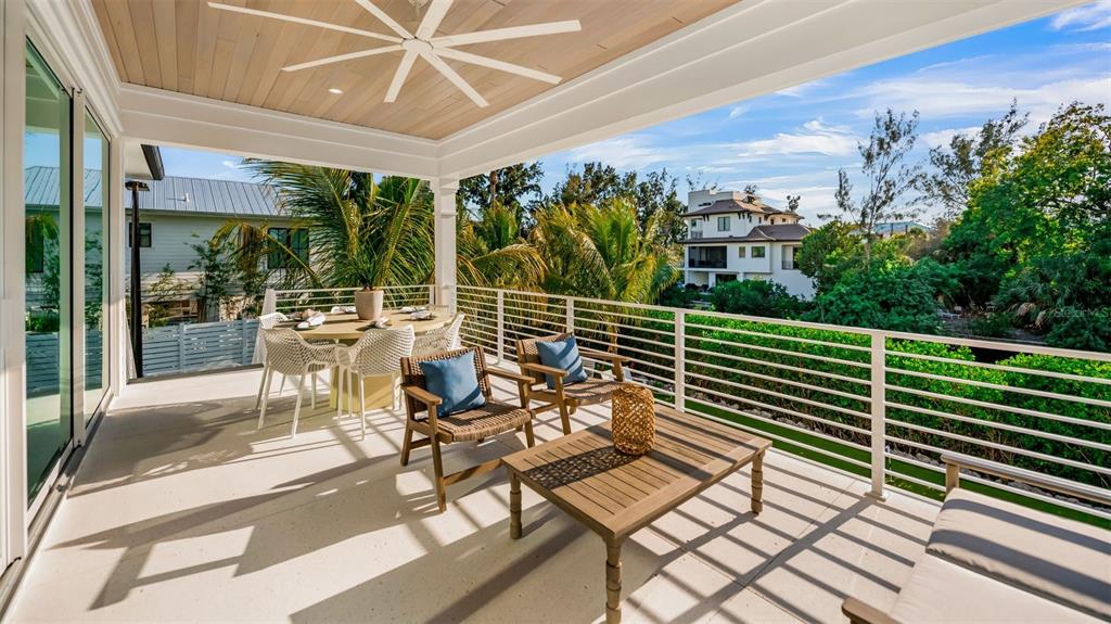 6536 Peacock Road Sarasota, FL 34242 - Photo 27 of 82 a view of a balcony with chairs