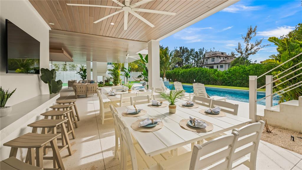 6536 Peacock Road Sarasota, FL 34242 - Photo 35 of 82 a view of an outside dining space with furniture